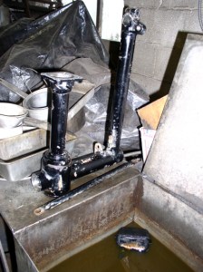 Swingarm and brake tie rod cleaned in the wash tank.