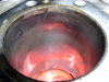The chrome plating of both cylinder bores was wearing thin in the area half way down from the top. The lighter speckled color showing through is the aluminum cylinder casting. 