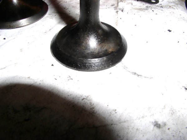 The intake valves are in excellent condition, but both exhaust valves will need to be refaced to remove pitting. 