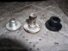 On to the tank. On the left is the non-original bushing that was on it. Center is the correct item and on the right the rubber bushing. With the short one, when the tank bolt was tightened, the 