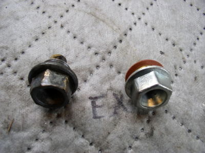 Engine oil drain plug was all boogered up, new replacement on right.